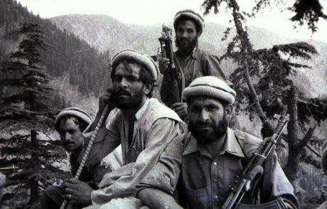 Black and white photo of several armed Mujahideen