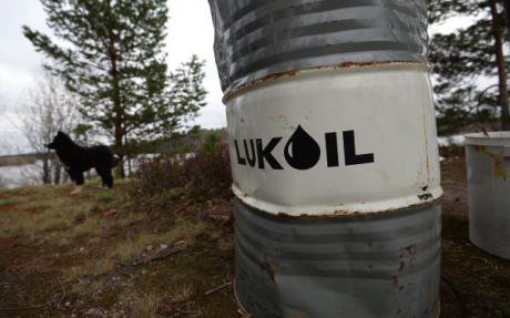 A barrel labelled 'Lukoil' sits in the middle of a field in Khanty-Mansiysk.