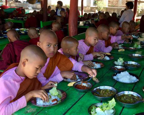 Buddhist pupils have lunch in a monastic school&#x27;s canteen in Shan State, Myanmar. 