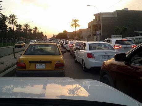 Cars old and new in Baghdad's frequent traffic jams. Ali Ali. All rights reserved.