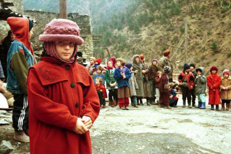 Chechen refugee children in Georgia in 1999. Their clothes are ragged.