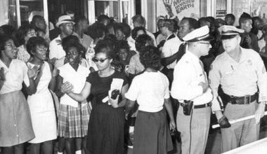 Civil_rights_demonstration_in_front_of_a_segregated_theater_Tallahassee,_Florida_(6847006931).jpg
