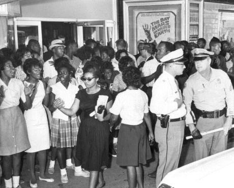 Civil_rights_demonstration_in_front_of_a_segregated_theater_Tallahassee,_Florida_(6847006931).jpg