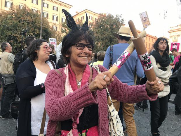 Women holding rolling pins at a women&#39;s rights protest in Rome