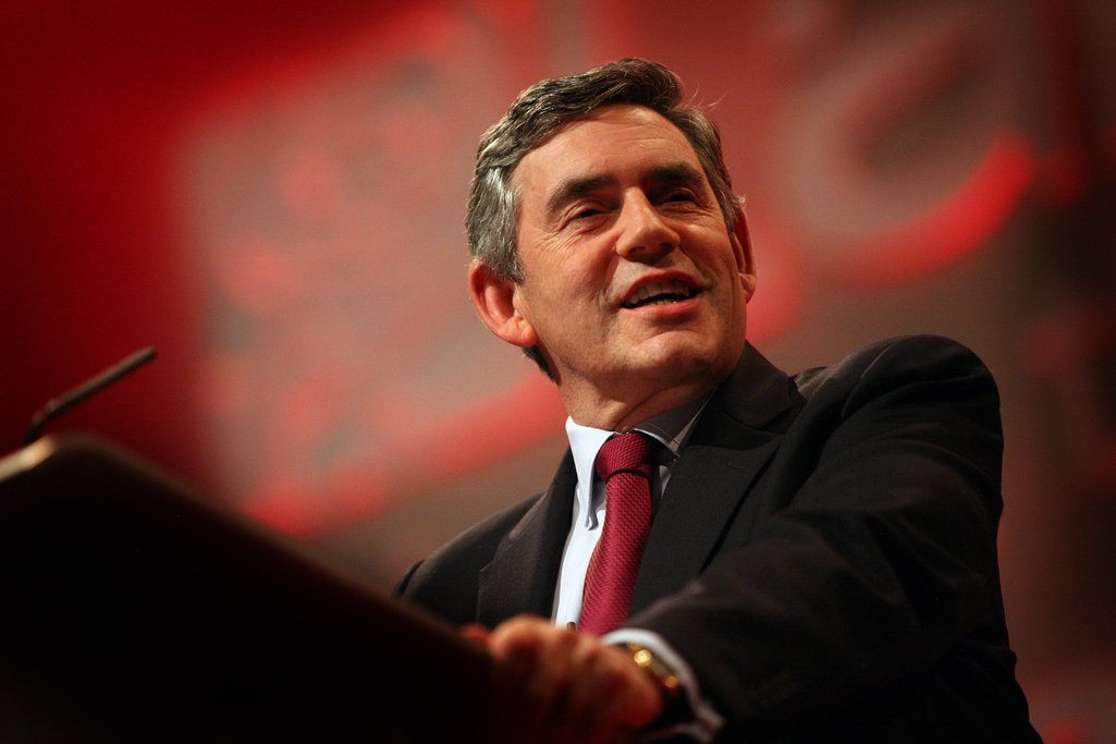 Gordon Brown smiles behind a podium, 2008