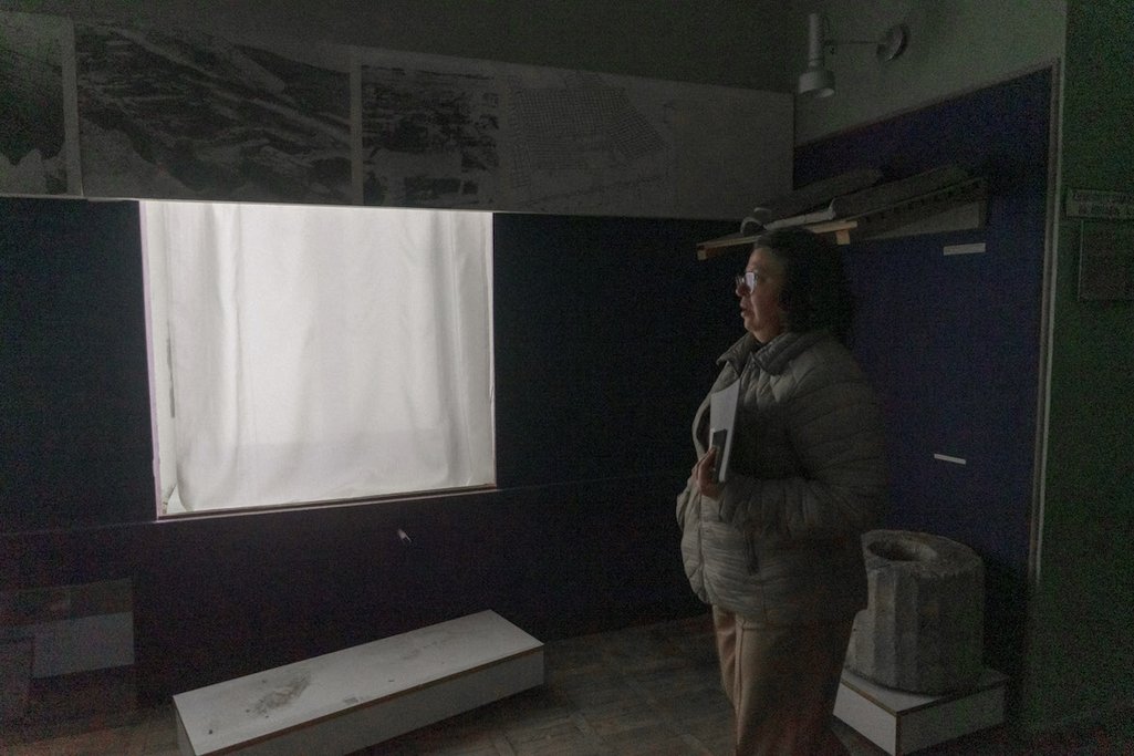 Elena Eremenko, museum secretary, stands in the looted museum