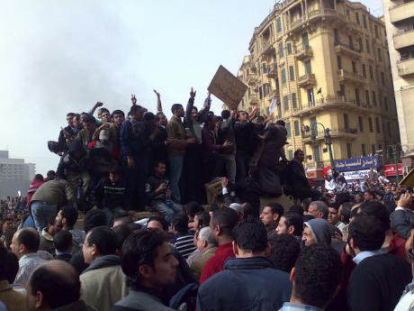 Protesters in Egypt&#39;s Tahrir Square mob an army vehicle. Such scenes made a deep impression on Russian officials.