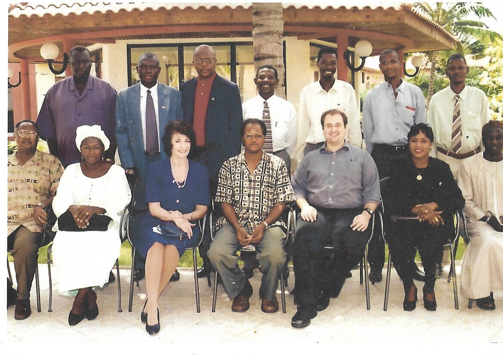 Deyda Hydara (seated extreme left) with a group of Gambian journalists after a meeting with officials of the American embassy (seated third and fifth from left; Demba Ali Jawo is sitting between them) in 2003