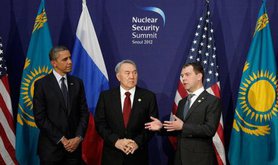 President Nazarbayev stands next to Dmitri Medvedev and Barack Obama at Seoul Nuclear Security Summit