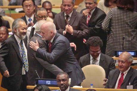 Fiji U.N. Ambassador Peter Thomson, center, receives congratulations from U.N. diplomats on his election as the new U.N. General Assembly president.jpg