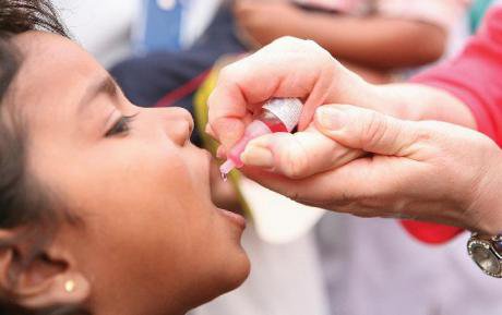 Child receiving a polio shot in Pakistan.