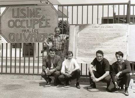 French_workers_with_placard_during_occupation_of_their_factory_1968.jpg