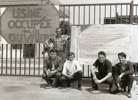 French_workers_with_placard_during_occupation_of_their_factory_1968_0.jpg