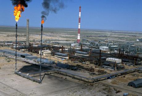 Flames move as excess gas is burned off at a Kazakh oil refinery.