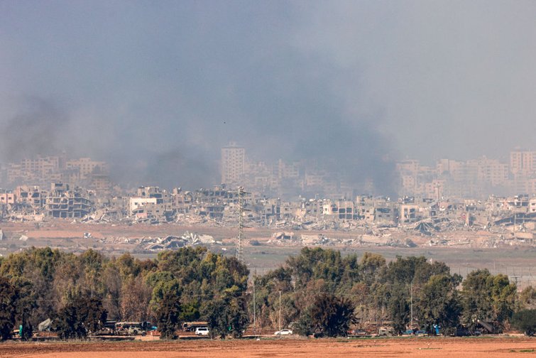 A picture taken from southern Israel near the border with the Gaza Strip on December 18 2023 shows smoke rising over the Palestinian territory following Israeli bombardment Photo by Menahem KAHANA  AFP Photo by MENAHEM KAHANAAFP via Getty Images