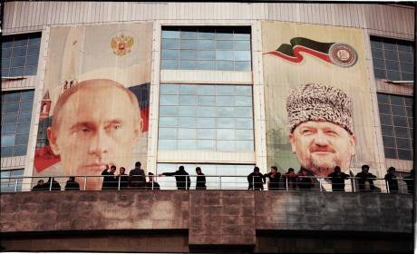 Former President of Chechnya Akhmad Kadyrov and Russian President Vladimir Putin survey the streets of Grozny, Chechnya