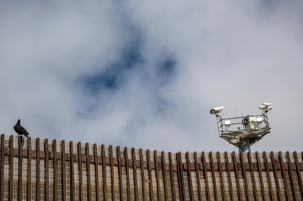 Tijuana, Mexico - U.S. Border Patrol surveillance cameras spy on a pigeon on the U.S.-Mexico border fence.
