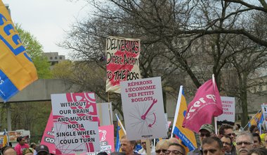 Protest signs in a Toronto rally for Foodora unionization
