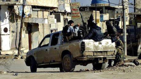 IS fighters in Raqqa with captured weapons, Jan 2014. AP Photo/Militant Website. All rights reserved.