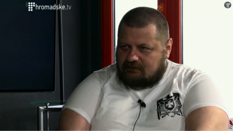 Ihor Mosychuk in the studio of Hromadske TV, wearing a t-shirt produced by the neo-Nazi brand Doberman Aggressive.