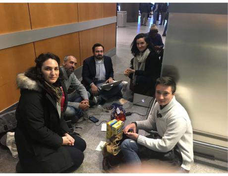 Intrepid CUNY law students in a makeshift outpost at JFK.jpg