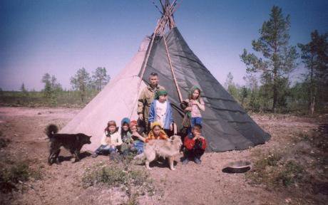 A Khanty family in front of a chum in 2006.