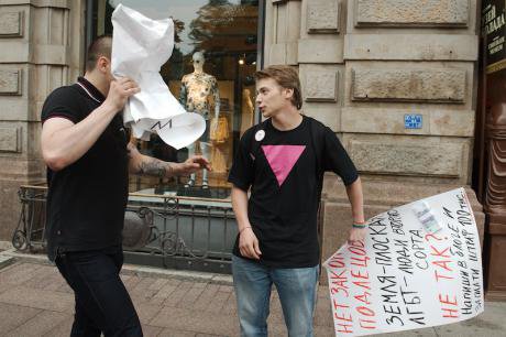 A single-person picket opposing the &#39;gay propaganda&#39; law attracts the ire of a passerby.