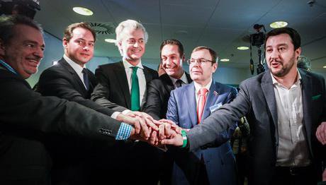Leaders of European Eurosceptic groups talk at the the Federal Congress of Lega Nord, unity symbolized by one hand atop another