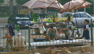Vendors underneath umbrellas
