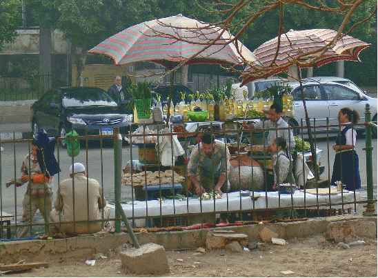 Vendors underneath umbrellas