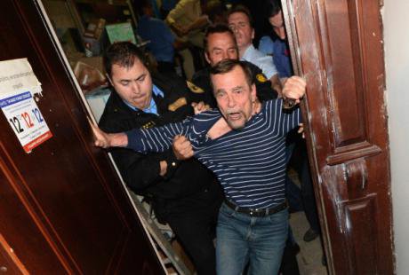 Lev Ponomaryov escorted from 'For Human Rights' after the Moscow government refuses to renew the organisation's lease.