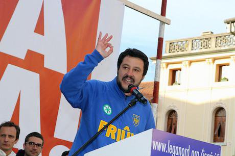 Matteo Salvini animatedly speaking from a podium.