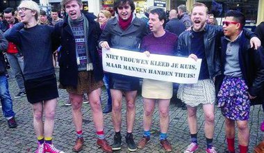 Men in mini-skirts pose for photographs at the start of the Amsterdam mini-rok protest. Jess Graham.​All rights reserved.