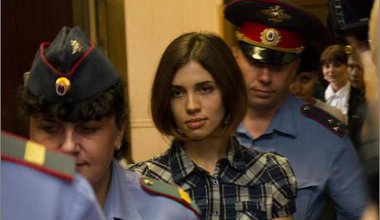 Tolokonnikova escorted by police during her trial.
