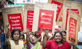 ActionAid-trained women garment workers in Savar, marching to demand their rights under Bangladesh labour laws.