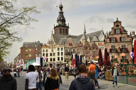 Historic, oldest city in Holland, walkers at forefront, cafes in background