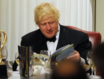 Boris Johnson with a copy of Dick Whittington during the Lord Mayor of the City of London's annual London Government Dinner at Mansion House, London. 17-Jan-2013
