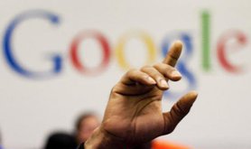 A man raises his hand in Google office.