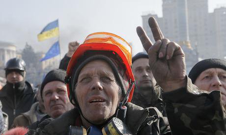 Protester gives the victory sign during a rally in Independence Square, Kiev in February 2014. Credit: Efrem Lukatsky / AP/Press