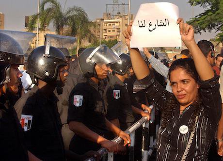 An Egyptian activist holds a poster which reads, "the street is ours". Amr Nabil/Press Association Images. All rights reserved.