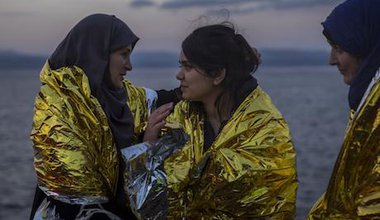 Three women arrive on Lesbos. AP Photo/Santi Palacios. All rights reserved.