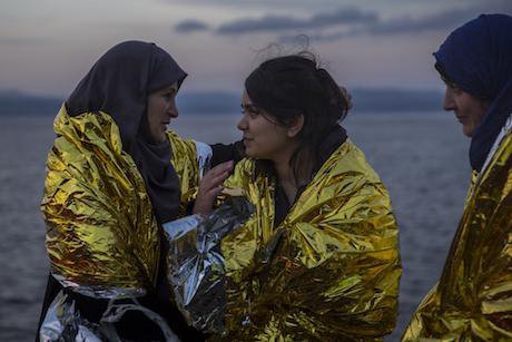 Three women arrive on Lesbos. AP Photo/Santi Palacios. All rights reserved.