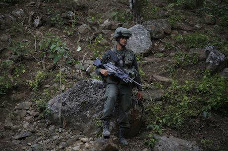 Counter-narcotics officer, Colombia. Fernando Vergara/AP/Press Association Images. All rights reserved.