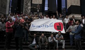 Arabic on the banner reads, "remove our shackles." Cairo. 3 May 2016. 
