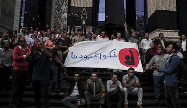 Arabic on the banner reads, "remove our shackles." Cairo. 3 May 2016. 