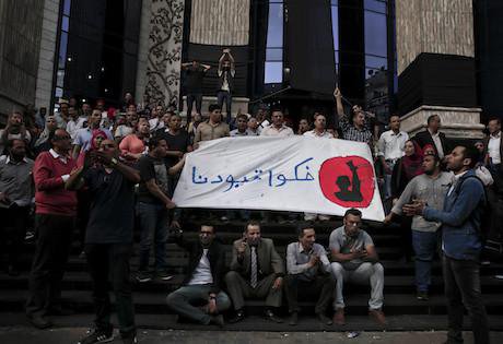 Arabic on the banner reads, "remove our shackles." Cairo. 3 May 2016.