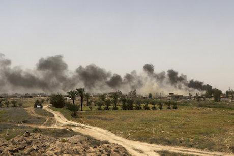 Smoke from IS positions outside Fallujah, May 2016. Khalid Mohammed/AP/Press Association Images. All rights reserved.