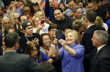 Hillary Clinton stops for a selfie. John Locher / AP/Press Association Images. All rights reserved.