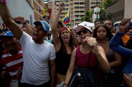 Opposition members chant in Caracas Venezuela. Credit: Fernando Llano/AP/Press Association Images. All rights reserved.