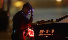 Dallas police officer. LM Otero/AP/Press Association Images. All rights reserved.